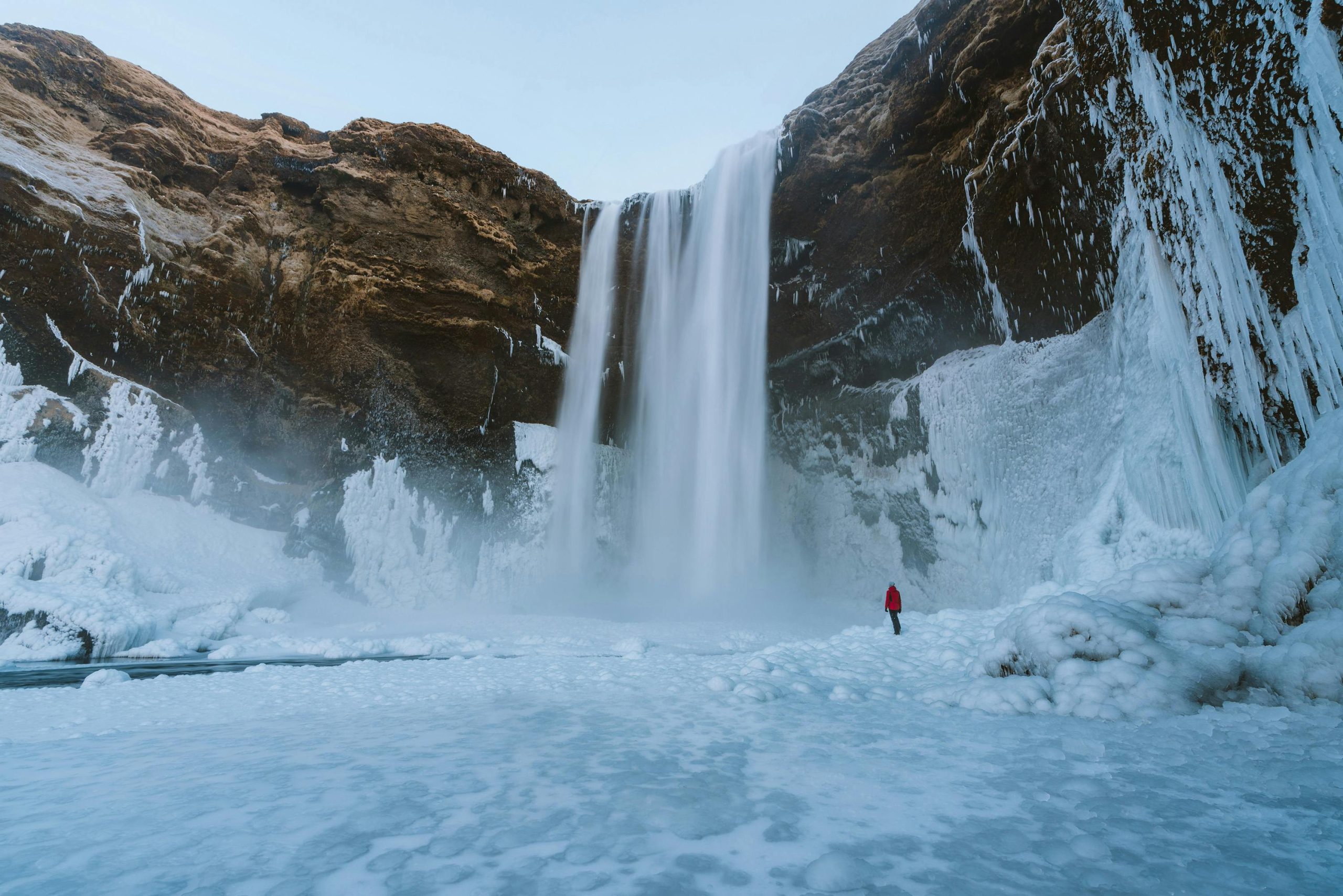 Person Walking on Snowfield